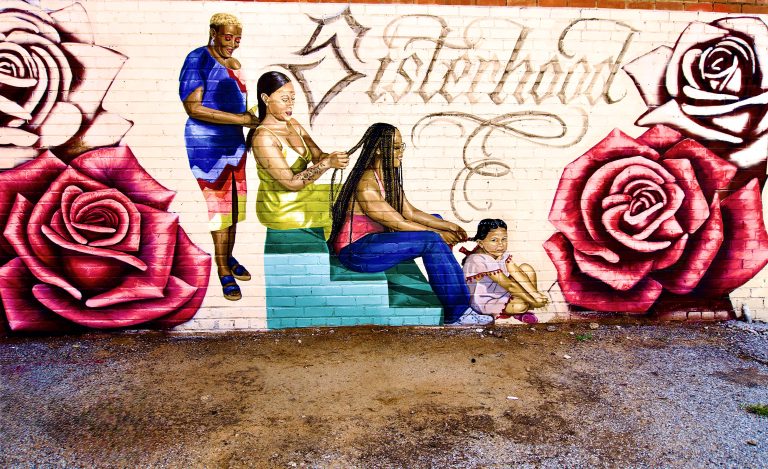 Mural in OKC 4 generations of women sitting together amid a display of blooming roses